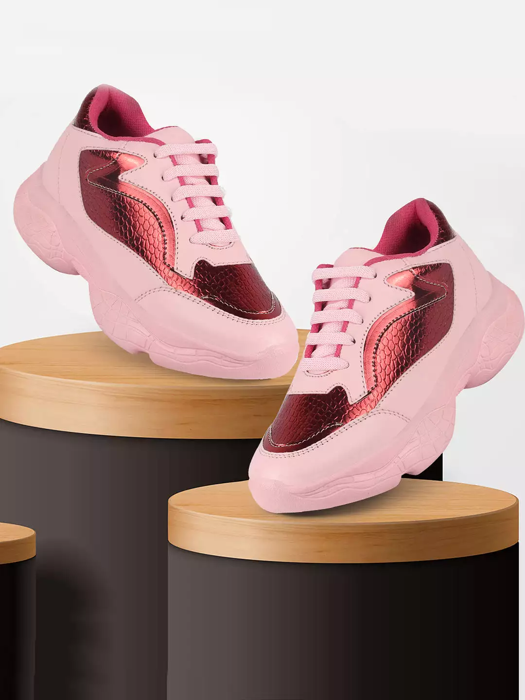 Pink women's sports and outdoor running shoes with lace-up design.